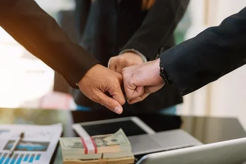 Teamwork business concept of group of three coworkers join hand Stock Photos