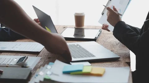 Teamwork with business people analysis cost graph on desk at meeting room. .. Stock Footage 248080124