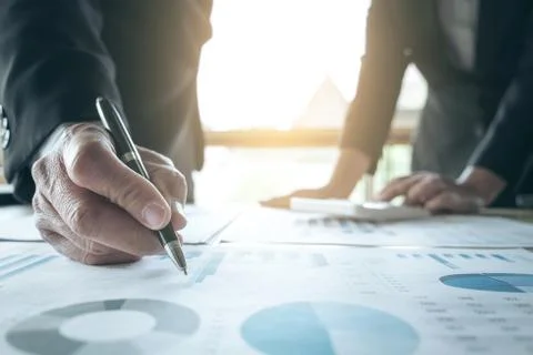 Teamwork of business two colleagues analysis with financial data and marketin Stock Photos