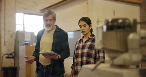 Teamwork, carpenter and tablet in factory, apprentice and planning furniture Stock Footage 285865005