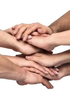 Teamwork, close up of many human hands stacked together isolated Stock Photos