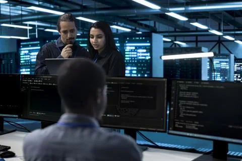 Teamwork, code review and collaboration with coworkers in data center Photos