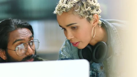 Teamwork, collaboration and diversity with a design team working on a computer Stock Footage 225654608