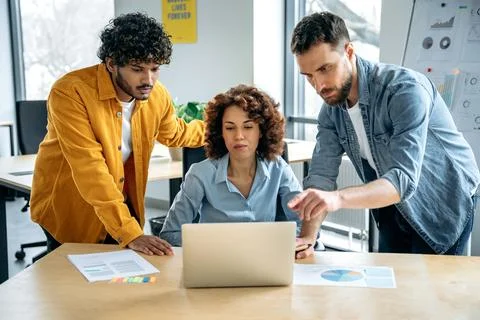 Teamwork, collaboration. Successful focused multiracial people, creative Stock Photos