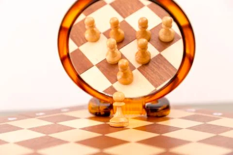 Teamwork concept, chess figures looking in mirror. One for all, all for one Stock Photos