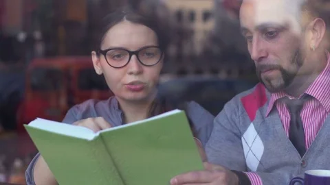 Teamwork, cooperation and creativity. Young business people meeting at cafe Stock-Footage 85224213