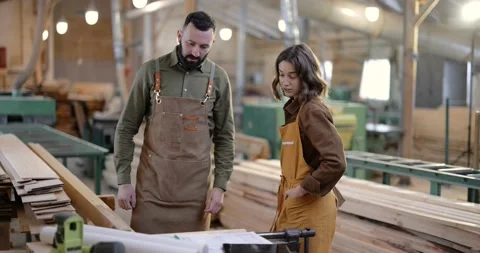 Teamwork of creative carpentry workers at the manufacturing Stock Footage 146913334