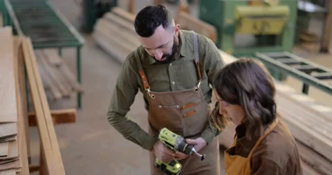 Teamwork of creative carpentry workers at the manufacturing Stock Footage 146914212