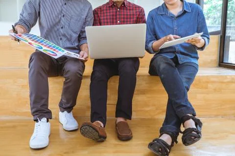 Teamwork of creative designers working on new project and choose color swatch Stock Photos