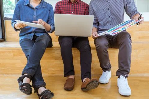 Teamwork of creative designers working on new project and choose color swatch Stock Photos