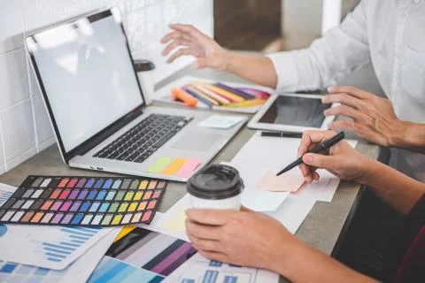 Teamwork of creative designers working on new project and choose color swatch Stock Photos