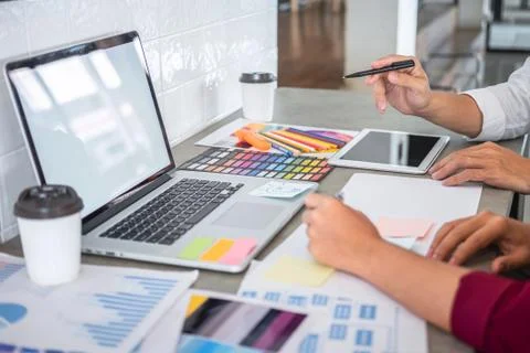 Teamwork of creative designers working on new project and choose color swatch Stock Photos