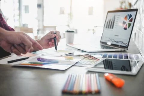 Teamwork of creative designers working on new project and choose color swatch Stock Photos