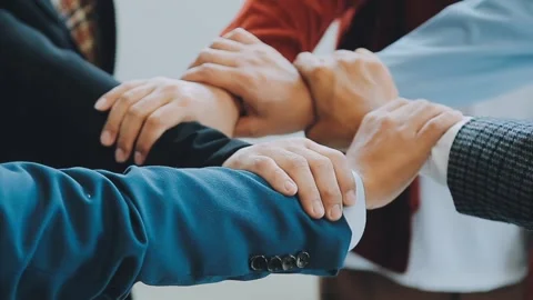 Teamwork demonstrates unity and strength among business professionals Stock Footage 325309073