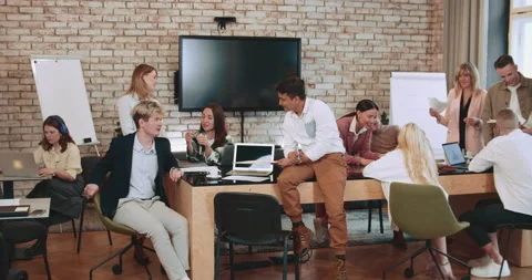 Teamwork discussion. Group of young professional business people, corporate Stock Footage 185790435