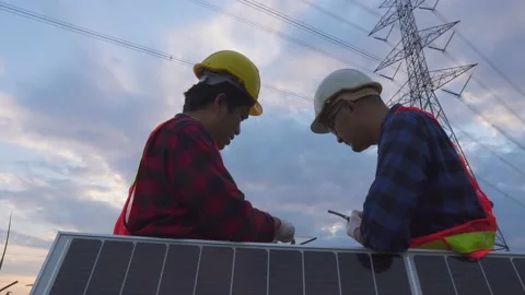 Teamwork engineering in standard safety uniform solar panel inspect. Stock Footage 217912263