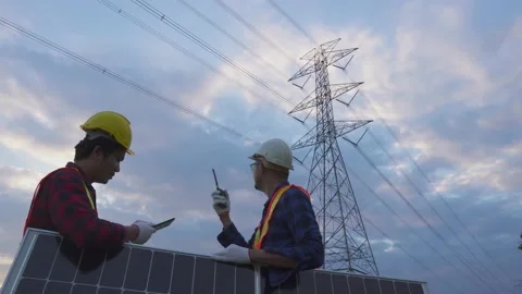Teamwork engineering in standard safety uniform solar panel inspect. Stock Footage 217912303