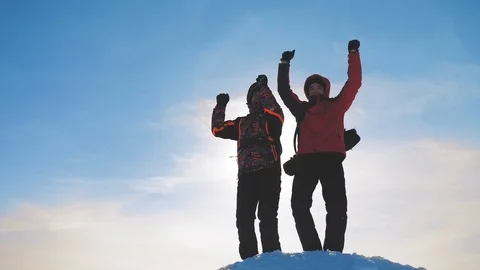 Teamwork. group men winter snow mountains team tourists joy success achievement Stock Footage 103467847