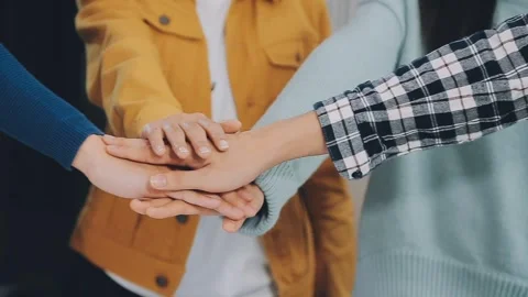 Teamwork hands on top of each other showing cooperation concept Stock Footage 325474637
