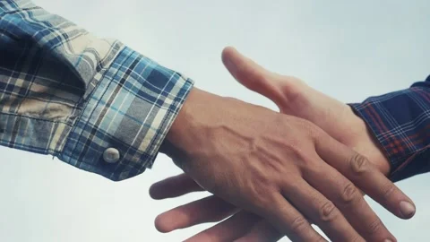 Teamwork handshake concept. two people shake hands shaking hands. different skin 스톡 동영상 164066028