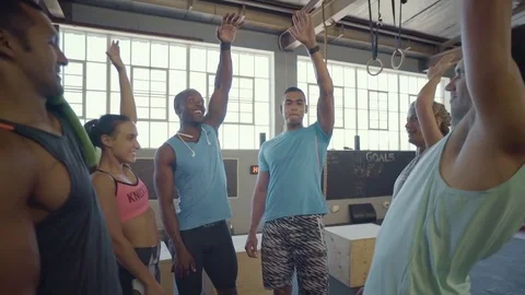 Teamwork high five in gym with multi ethnic friends Stock Footage 71618349