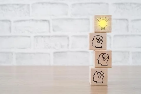 Teamwork, Many people together having idea symbolized by icons on cubes on .. Stock Photos