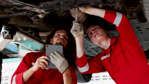 Teamwork mechanic examining together damage car after accident, Caucasian r.. Stock Footage 249344026