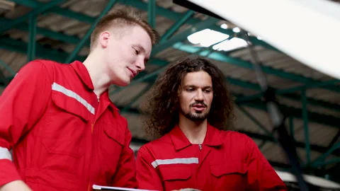 Teamwork mechanic examining together damage car after accident, Caucasian r.. Stock Footage 249344093