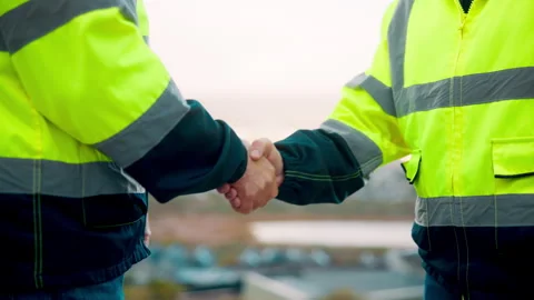 Teamwork, men and handshake for construction in city for collaboration Stock Footage 336216943