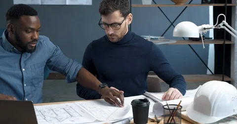 Teamwork in modern loft Office of stylish Engineer and Architect. Two Workers on Видео 126162674