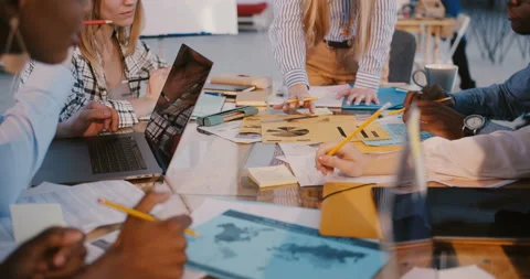 Teamwork at multiethnic workplace. Close-up shot, hands of business people Stock Footage 107385571