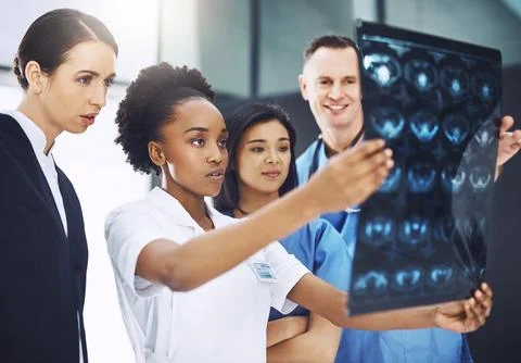 Teamwork, nurse and surgery with doctors and xray for medical results, help or Stock Photos