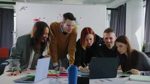 Teamwork in office.Multinational team is thinking over a development strategy Stock Footage 257419685