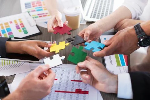 Teamwork of partners. Concept of integration and startup with puzzle pieces 写真素材