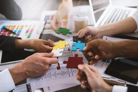 Teamwork of partners. Concept of integration and startup with puzzle pieces 写真素材