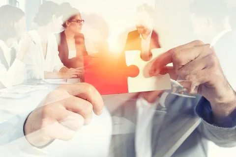 Teamwork of partners. Concept of integration and startup with puzzle pieces 写真素材