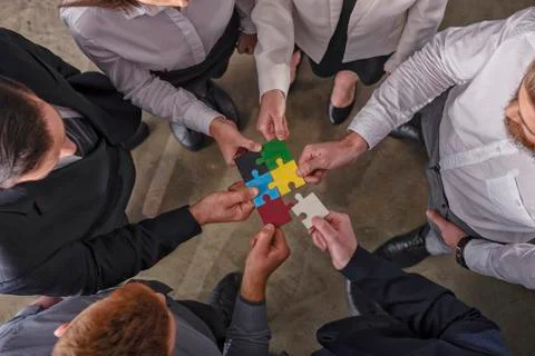 Teamwork of partners. Concept of integration and startup with puzzle pieces. 写真素材