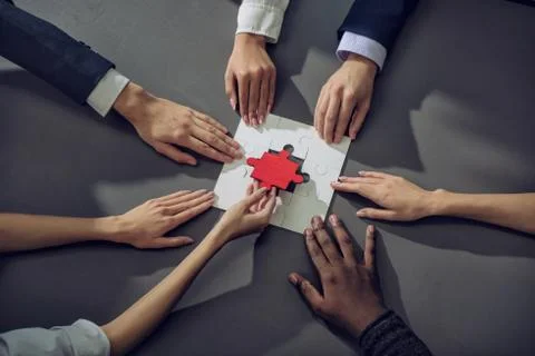 Teamwork of partners. Concept of integration and startup with puzzle pieces Stock Photos