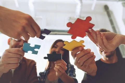 Teamwork of partners. Concept of integration and startup with puzzle pieces Foto stock