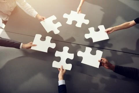 Teamwork of partners. Concept of integration and startup with puzzle pieces Foto stock