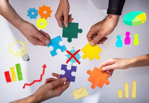 Teamwork of partners. Concept of integration and startup with puzzle pieces Stock Photos