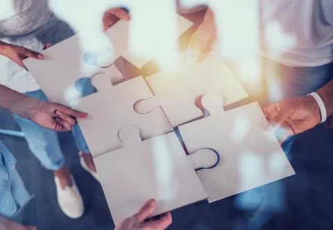 Teamwork of partners. Concept of integration and startup with puzzle pieces Foto stock