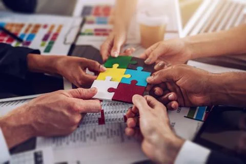 Teamwork of partners. Concept of integration and startup with puzzle pieces 写真素材