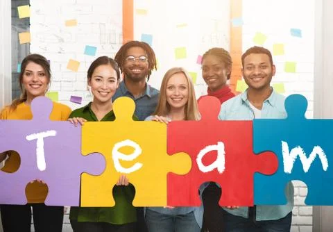 Teamwork of partners. Concept of integration and startup with puzzle pieces Stock Photos