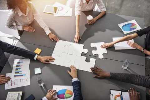 Teamwork of partners. Concept of integration and startup with puzzle pieces Foto stock