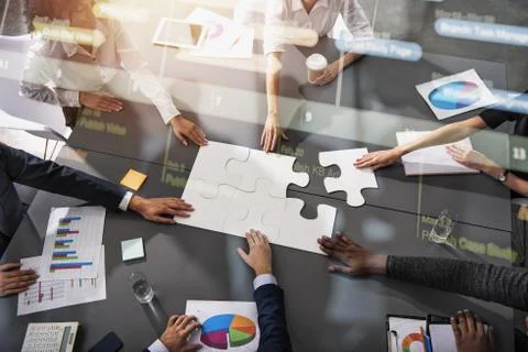 Teamwork of partners. Concept of integration and startup with puzzle pieces Stock Photos