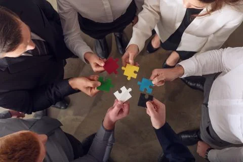 Teamwork of partners. Concept of integration and startup with puzzle pieces 写真素材