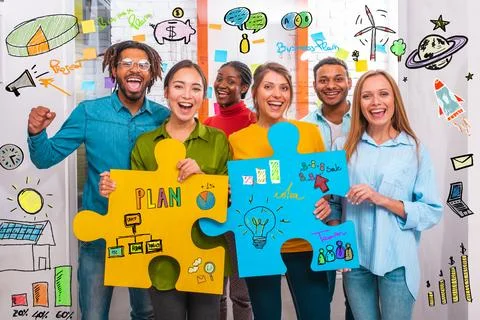 Teamwork of partners that work with puzzle on a new creative business project Foto stock