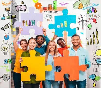 Teamwork of partners that work with puzzle on a new creative business project Stockfoto's
