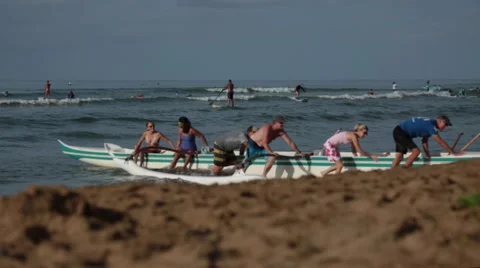 Teamwork, people pulling boat from water to coast, sunny day Stock Footage 57402994